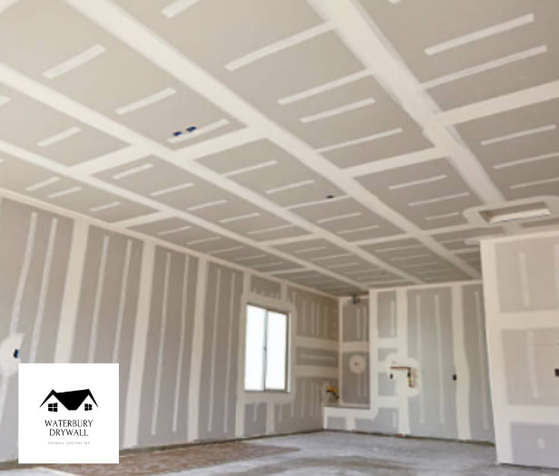 this is a picture of drywall being installed by waterbury drywall