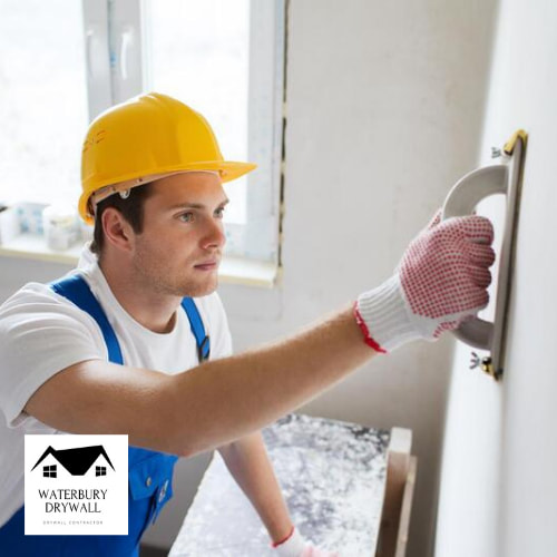 this is a picture of a drywall contractor from waterbury drywall finishing drywall